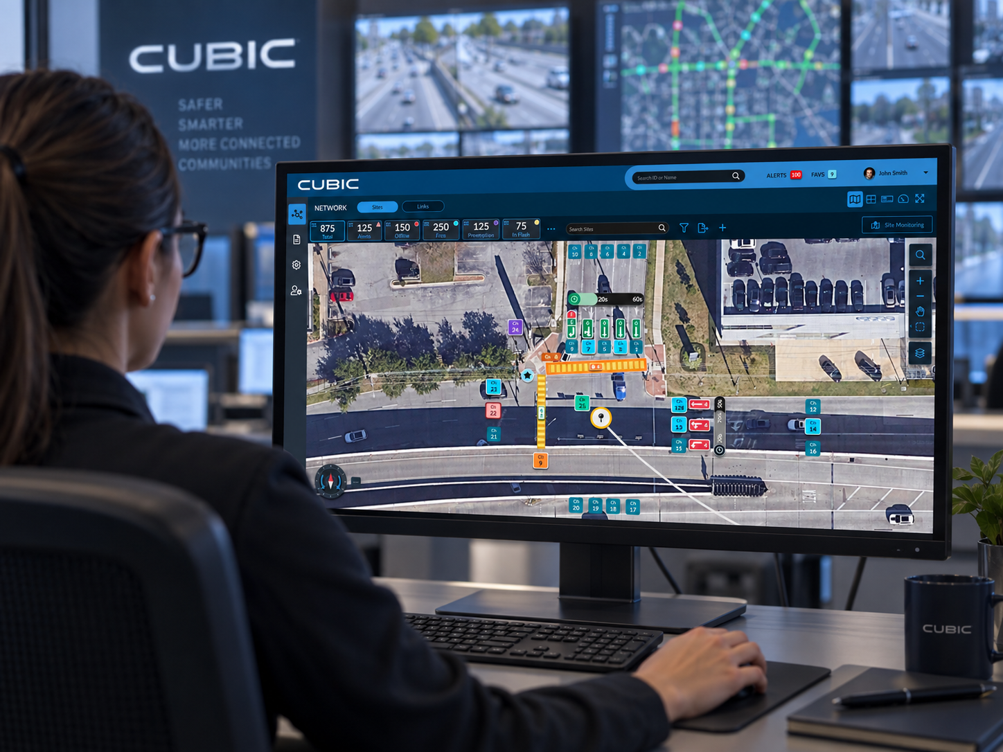 Traffic engineer using the Cubic map-first site configuration interface in a traffic operations center.